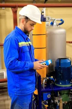 Maintenance engineer  tests of devices equipment and launch technological pro Stock Photos