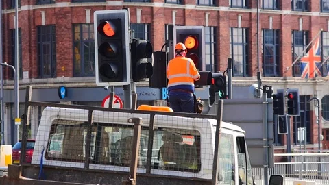 Maintenance engineer working on traffic light in the city of leeds uk Stock Footage 114121499