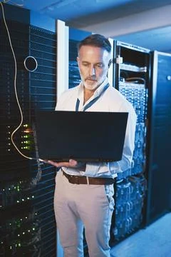 Maintenance, laptop or technician in server room with review, network or system Stock Photos