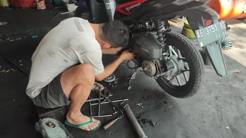 Maintenance motorcycle in workshop Stock Footage 249288145