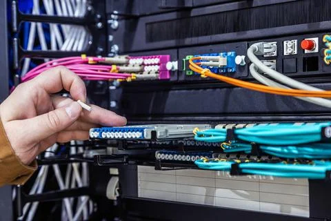 Maintenance of the network switch rack incoming and outgoing outputs Stock Photos