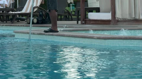 Maintenance person cleaning the pool Video stock 294497812