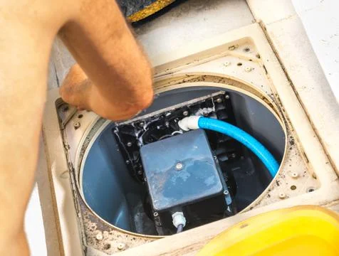 Maintenance of the pumping system of a pool Stock Photos