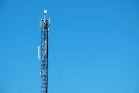Maintenance staff at the work. High-altitude work. Worker repair cell tower Stock Photos