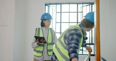 Maintenance, team and tablet in building with measurement, renovation planning Stock Footage 341466999