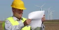 Maintenance Technician Planning Future Wind Spin Turbine Installation Placement 4k or 4k+ Resolution