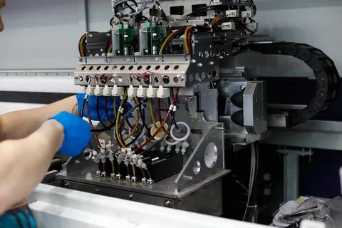 Maintenance work on large format fabric printer Stock Photos