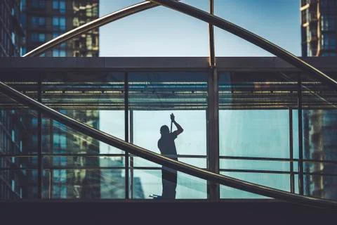 A maintenance worker cleaning windows Stock Photos