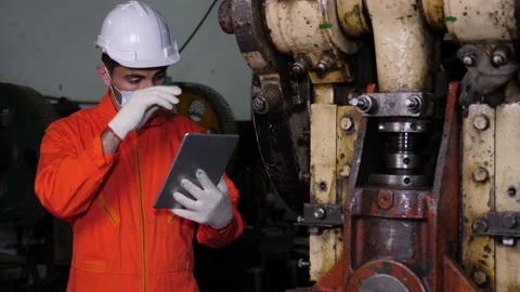 Maintenance worker or engineer using digital tablet, wiping sweat, inspecting. Stock Footage 196439905