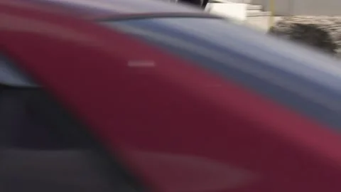 Maintenance worker rides unicycle cleaning parking lot with leaf blower Vidéo 152605443