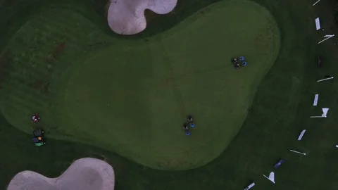 Maintenance workers clear golf course, Overhead shot Stock Footage 73810225
