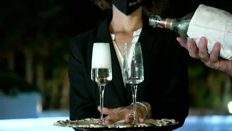 The maître pours the champagne Stock Footage 167699728