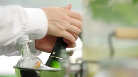 The maître pours the champagne Stock Footage 167700973