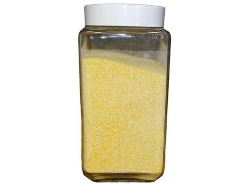 Maize flour in a glass container Фото
