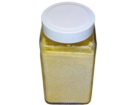 Maize flour in a glass container Stock-Fotos