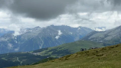 Majestic Austrian Alps Mountain Range with Dynamic Clouds Drifting Over Pea.. Stock Footage 343545222