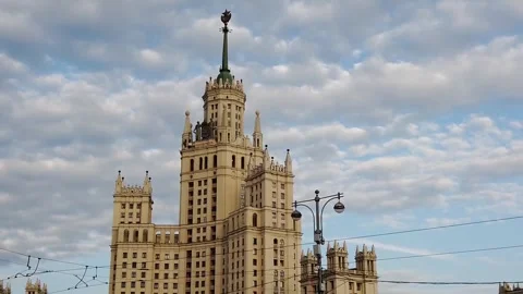 Majestic building under dynamic cloud with electrical wires in urban skyline Stock Footage 330119808