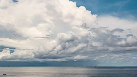 Majestic Clouds Drifting Gracefully Over Tranquil Sea Waters. Stock Footage 301171576