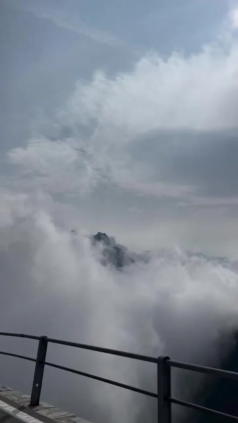 Majestic Clouds Rolling Over Alpine Mountain Peaks Stock Footage 339881504