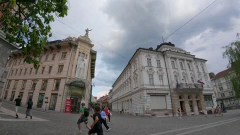 Majestic corner building at a street intersection in downtown Ljubljana Stock Footage 346168280