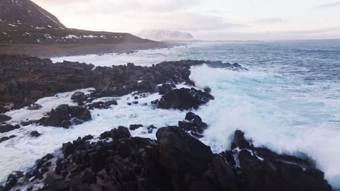 Majestic Dynamic Ocean Waves Powerfully Crashing on the Rocky Shoreline From Stock Footage 303703750