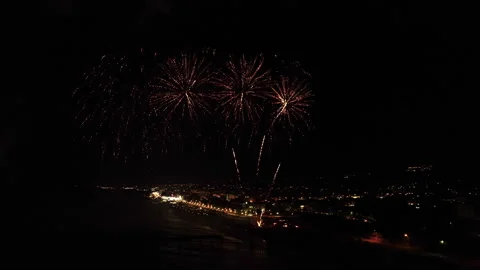 Majestic fireworks explode over the sea Stock Footage 327980874