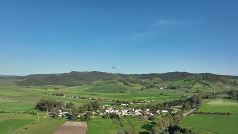 Majestic flight of booted eagle or Hieraaetus pennatus in slow-motion above Stock Footage 179484177