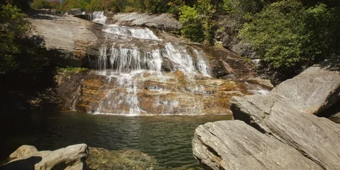 Majestic Graveyard Fields lower waterfall flowing over the rocks Stock Footage 103820291
