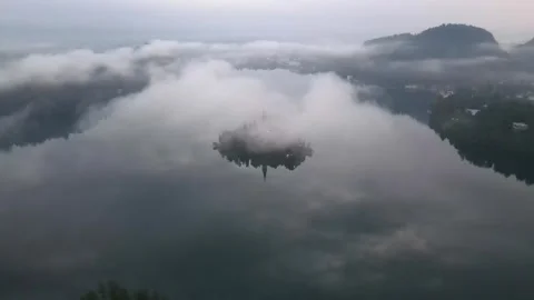 Majestic Lake Surrounded by Clouds Stock Footage 270213109