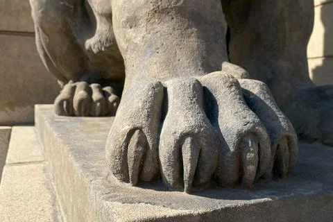 Majestic lion statue's powerful paws, symbolizing the historical significan.. Stock Photos