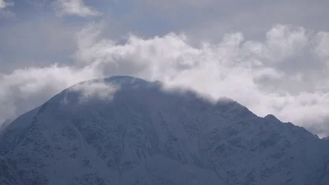 Majestic Mount Elbrus, the highest peak in Europe, rises above the clouds in the Stock Footage 320856101