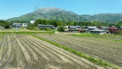 Majestic Mount Ibuki in the background under bright sunny daylight.  Stock-Footage 334583028