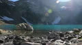 Majestic mountain lake scenery, rocks in blue water, sunshine HD Footage