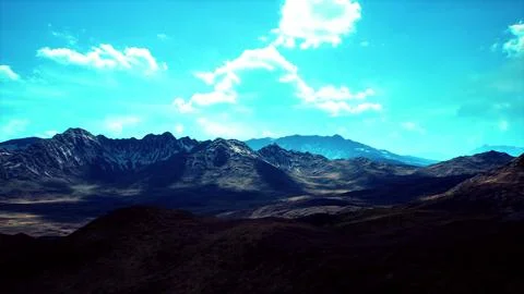 Majestic mountain landscape with dramatic clouds in a clear blue sky Stock Illustration