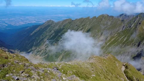 Majestic mountain landscape with moving clouds and deep valleys. Stock Footage 344041257