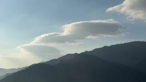 Majestic Mountain Peaks Under Dynamic Time-lapse Cloud Flow Video stock 328292353