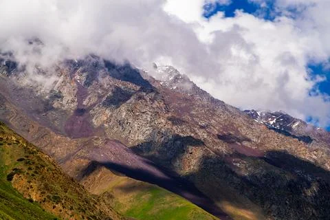 Majestic mountain range with dramatic textures and colors in Kyrgyzstan Stock Photos