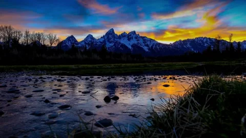 Majestic Mountain Range at Sunset Reflected in Calm River 스톡 동영상 311391371