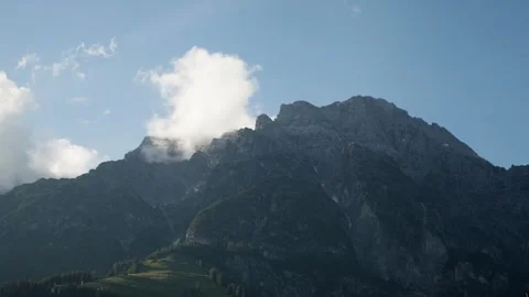 Majestic Mountain Range Under Blue Sky Stock Footage 303904534