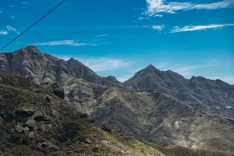 Majestic mountain range under a clear blue sky Stock Photos