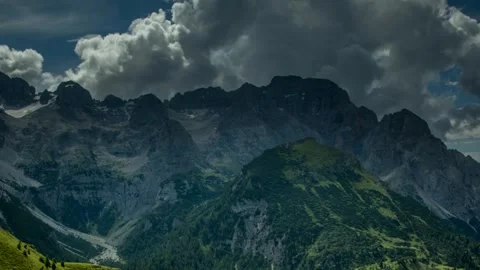 Majestic Mountain Range Under Dramatic Cloudy Sky Stock Footage 323298611