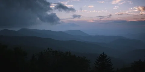 Majestic mountain ranges and dramatic sky at sunset Stock Footage 103398202