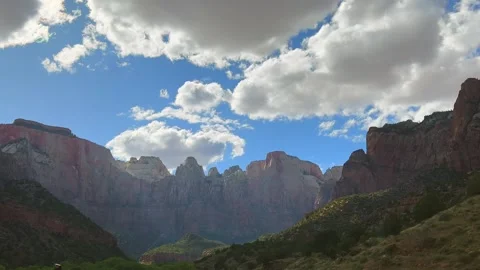 Majestic mountain scenery under dramatic cloudy skies. Towering rocky cliffs Stock Footage 304734091