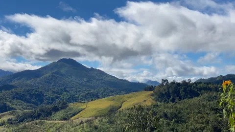 Majestic Mountain Timelapse: Rolling Clouds Over Lush Valleys with field Stock Footage 306170313