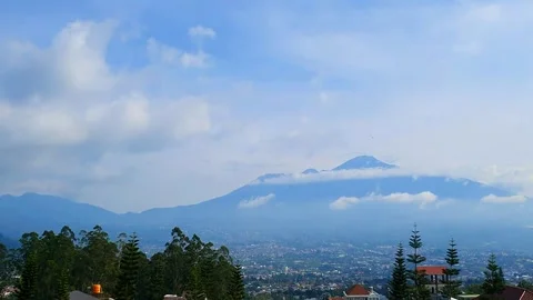 Majestic Mountain View timelapse: Clouds Enveloping Peaks Above a Sprawling.. Stock Footage 301064599