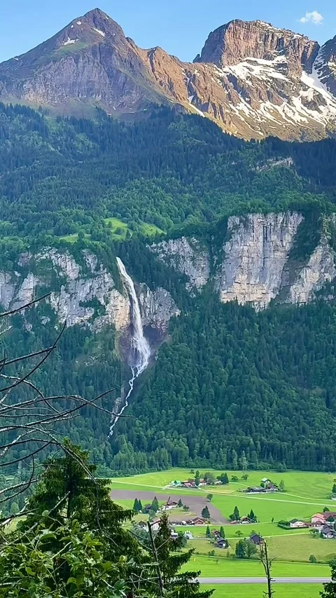 “Majestic Mountain Waterfall from a Unique Angle” Video stock 310938320