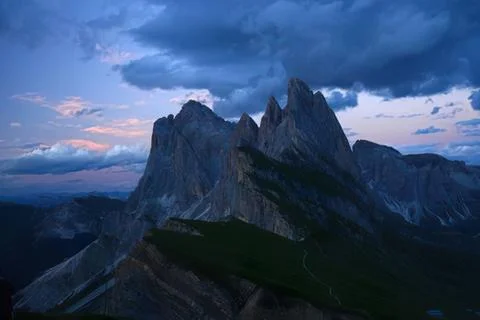 Majestic mountains at dusk with dramatic clouds Stock Photos