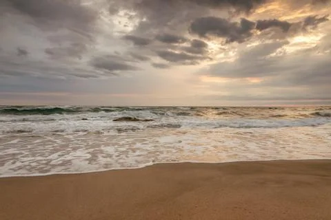 Majestic ocean sunset with a breaking wave Foto stock