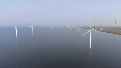 Majestic offshore wind turbine array in the tranquil waters of the Netherlands Stock Footage 331418038