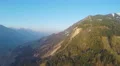 Majestic panoramic view of mountain range in sun rays, magic hour, blue sky 4k or 4k+ Resolution